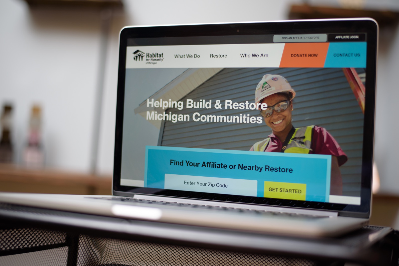 The Habitat for Humanity Michigan website on a laptop